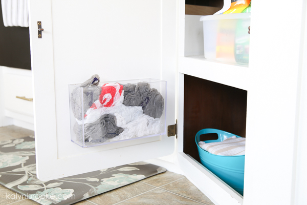 plastic bag holder inside a cabinet