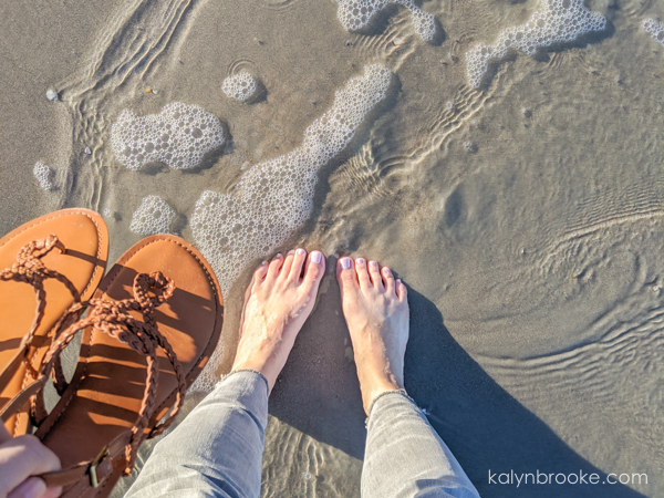 woman barefoot on the beach