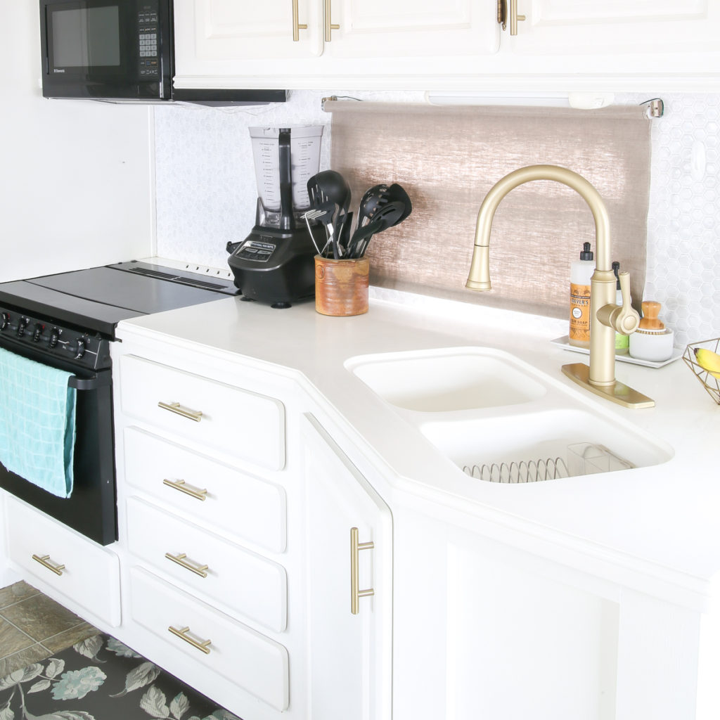 kitchen sink with beautiful utensil holder