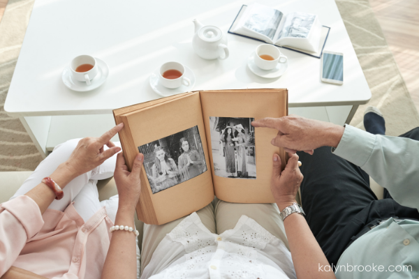 family looking at a photo album together